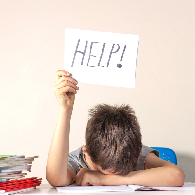 A child holding a “help” sign seeking aid from visualization strategies for children