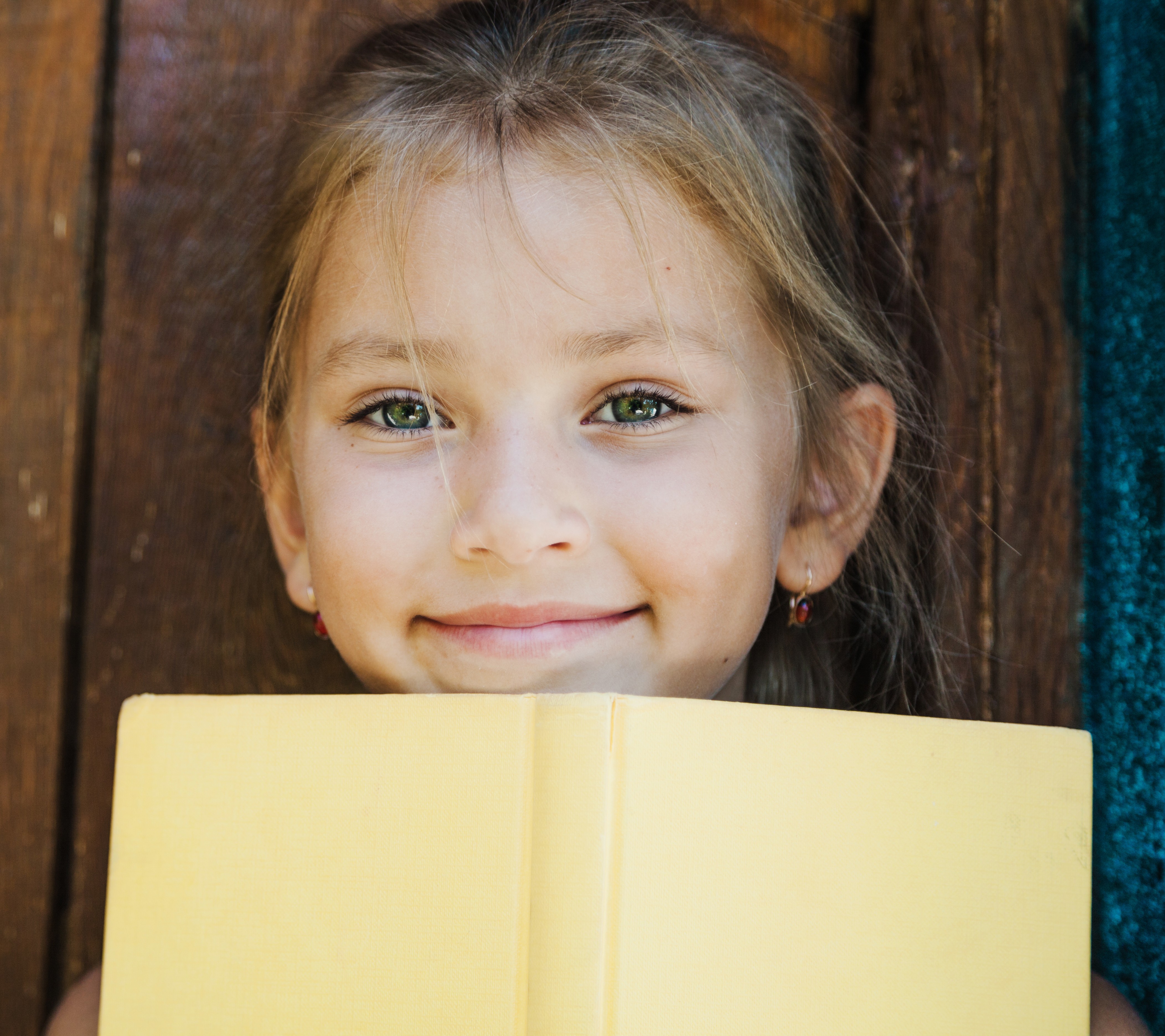 Young student holding a book – building reading comprehension skills