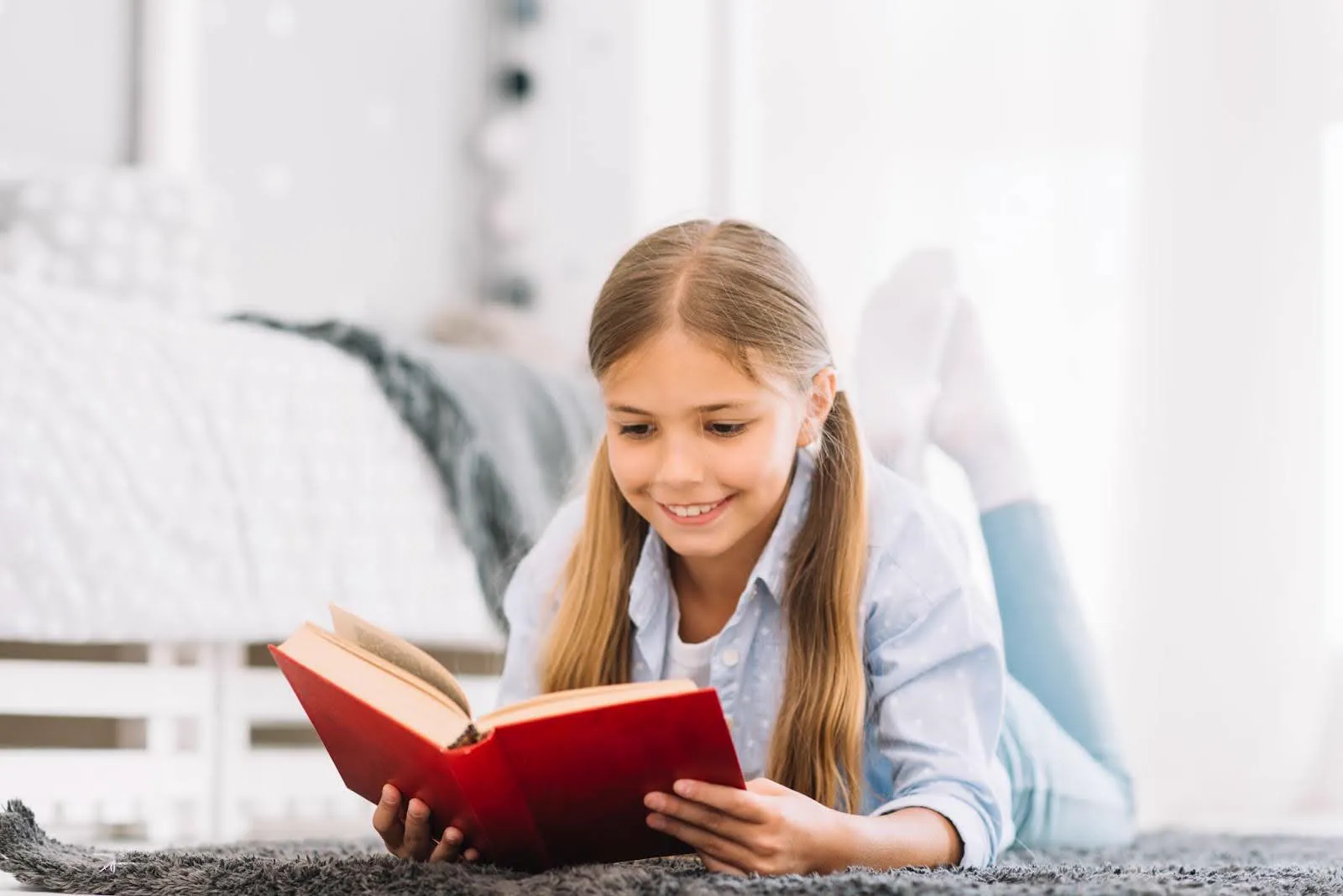 Child happily reading a book, overcoming reading anxiety.