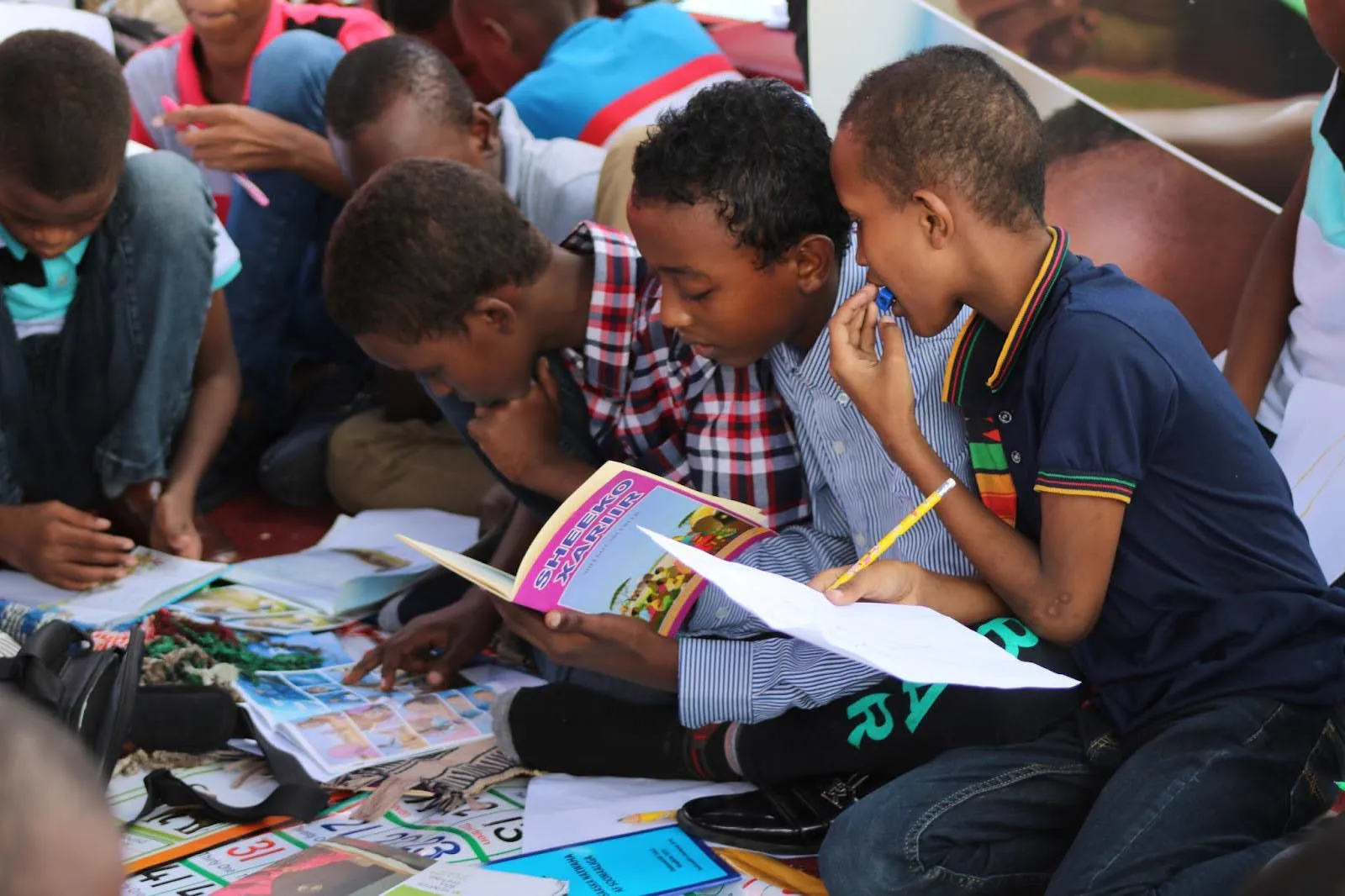 Children reading together on the floor