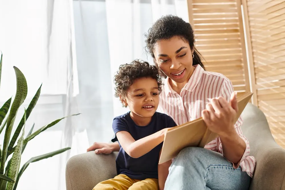 A child practicing reading strategies for kids with dyslexia with their mother.