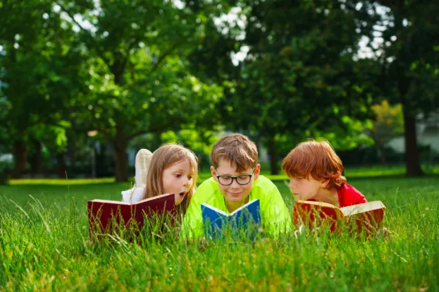 3 children enhancing reading comprehension skills.