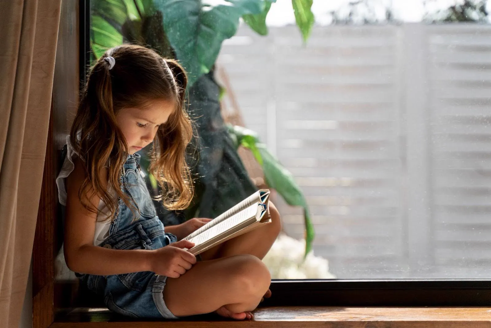 Child reading a book and overcoming reading anxiety.