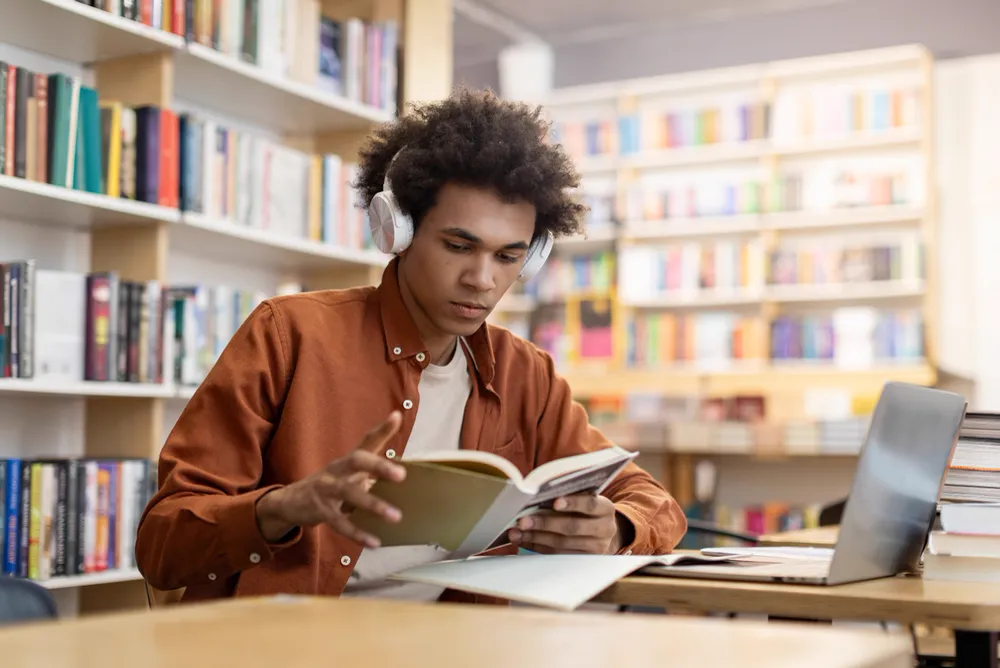 A man practicing questioning techniques for reading comprehension.